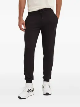 Ea7 Emporio Armani: Чёрные брюки 