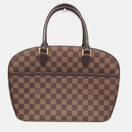 Louis Vuitton: Коричневая сумка 