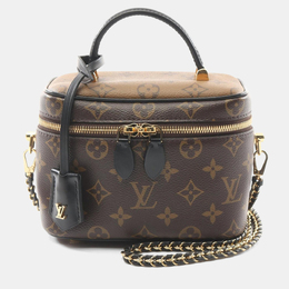 Louis Vuitton: Коричневая сумка 