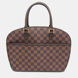 Louis Vuitton: Коричневая сумка 